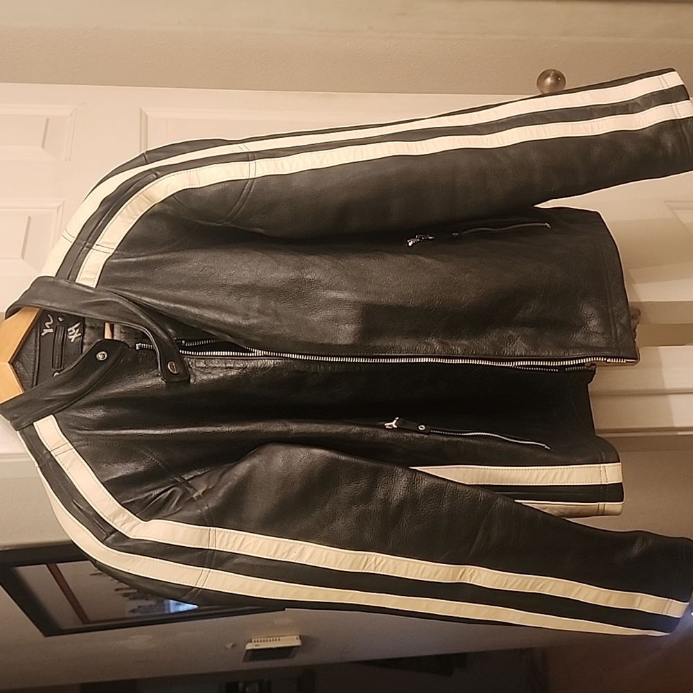Wilson's leather jacket, size medium. Black with white stripes on sleeves